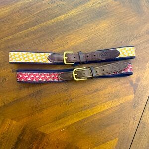 Vineyard Vines belts red fish is size 28 orange boat is size 30.